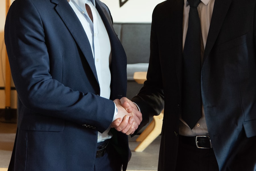 Two business partners shaking hands after an agreement