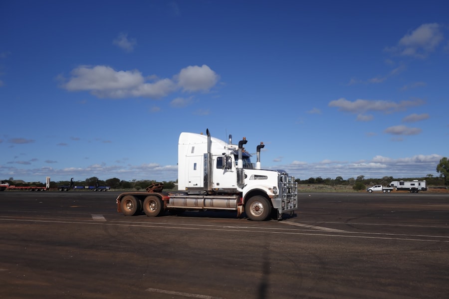Semi-truck parked under a blue sky